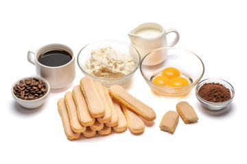 Ingredients for cooking tiramisu Savoiardi biscuit cookies, mascarpone, cream, sugar, cocoa, coffee and egg isolated on white background. Clipping path