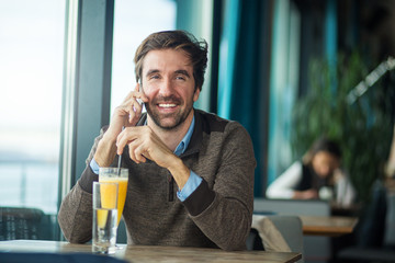 Happy man talking on the smartphone