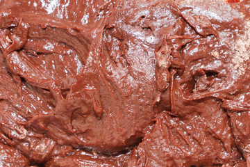 Prepared dough for dessert chocolate brownie before baking