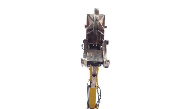 A ground view of a excavator travelling along on a construction site