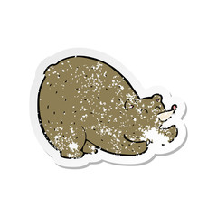 retro distressed sticker of a cartoon stretching bear