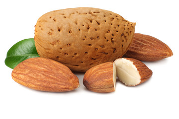 almond with green leaves isolated on white background