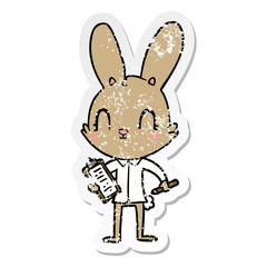 Obraz premium distressed sticker of a cute cartoon rabbit with clipboard