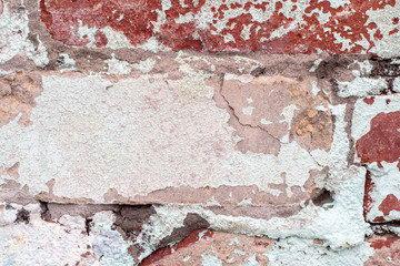  Destruction of a plastered wall as a background. Close-up