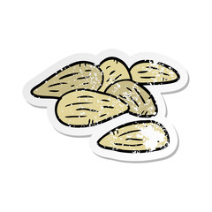 distressed sticker of a cartoon almonds