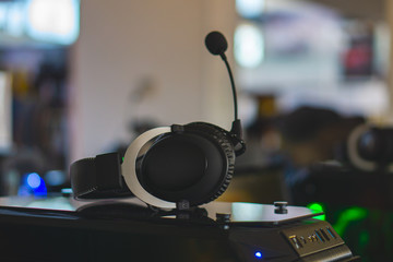 Obraz na płótnie Canvas Computer stereo headset with microphone is on the PC