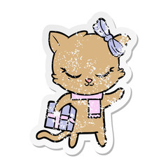 distressed sticker of a cute cartoon cat with present