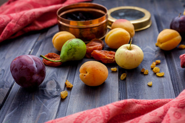 Set of fresh fruits and berries on wooden background