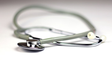 Medical stethoscope on the white background. Selective focus. 