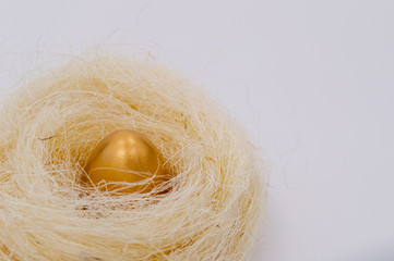Easter golden decorated eggs on white background. Minimal easter concept. Happy Easter card with copy space for text. Top view, flatlay.