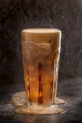 Glass of coke with ice on a dark background. Carbonated beverages. Selective fokus.