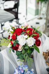 Bouquet of white and red flowers on the table