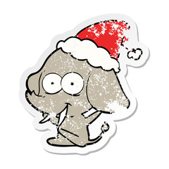 happy distressed sticker cartoon of a elephant wearing santa hat