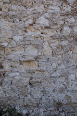 Old beige and gray stone wall blocks for background