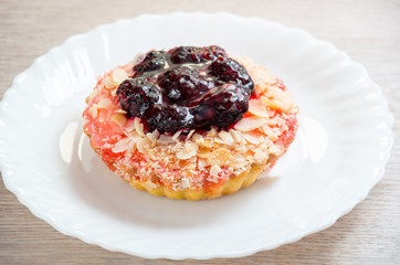 Basket-cakes with strawberry on white glass plate
