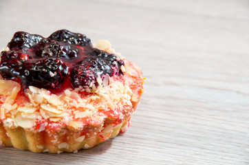 Basket-cakes with strawberry on white glass plate