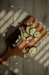 cucumber on woodwn background with fresh vegetables