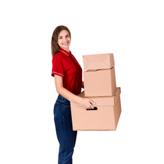 Smiling businesswoman is holding a lot of big cardboard boxes isolated on white background