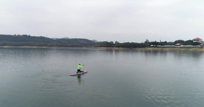 aerial view of man kayaking on lake