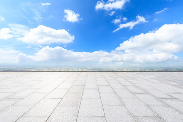 Empty square floor and modern city skyline with beautiful clouds