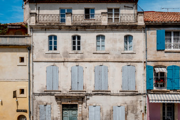 windows in an old facade typical of the French provence