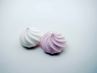 Meringue cookies on a white background. Sweet pastries.
