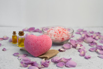 organic cosmetic with rose oil on grey background