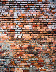 Weathered stained old brick wall background