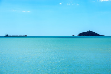 Empty Container Ship and the Tino island - Liguria Italy