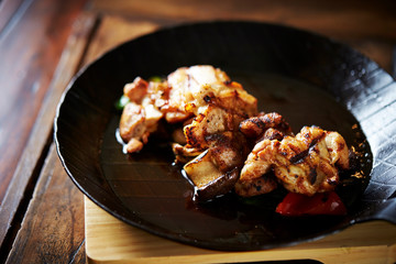 Grilled chicken on frying pan 