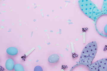 Table top view shot of decorations Happy Easter holiday background concept.Flat lay eggs with cute bunny ear & confetti for decor party festival on modern rustic pink paper.Copy space for design web.