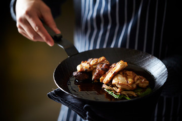 Grilled chicken on frying pan 