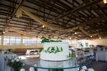 A two tiered white wedding cake