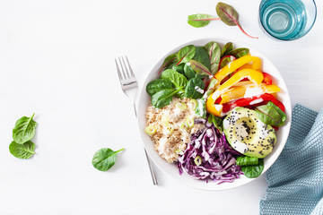 veggie couscous lunch bowl with avocado, bell peppers, spinach and red cabbage