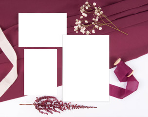 Burgundy wedding invitation set mockup with silk ribbon and astilbe
