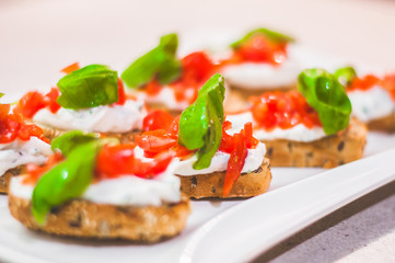 Cream cheese with herbs on a white bread