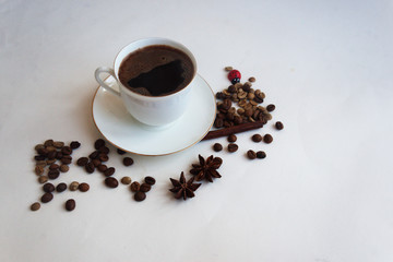 A cup of coffee with grains and anise stars. Candid.