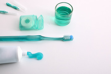 Equipment for oral hygiene on a white table elevated view