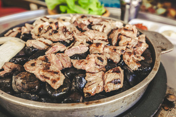 Hongdae stone grill Korean barbecue bbq beef close up, street food in south korea