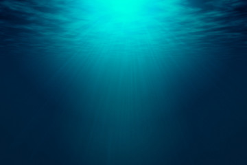 Deep blue sea with rays of sunlight, ocean surface seen from underwater. Background texture with...