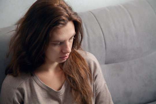 Portrait of a young woman. Emotions of sadness and depression.