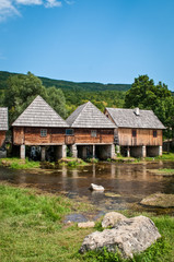 Fototapeta na wymiar Water mills on Mayer spring, river Gacka, Gacko Polje, Otocac, Lika, Central Croatia