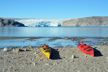 Two kayaks in fron of the Artic ice pack, Greenland