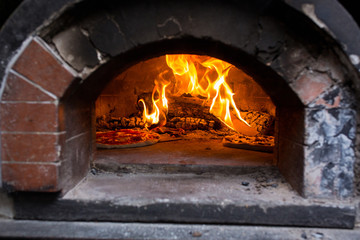 Pizzas in firebrick oven
