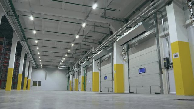 Cool angle view of the automatic gate inside the empty logistics center