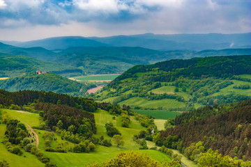 Lovely landscape view of the Werra Valley, the Hessian low mountains and the Ludwigs Castle on the far left. Taken from the famous Hanstein Castle, one of the largest castle ruins in Central Germany.