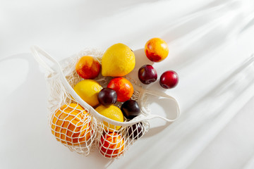 Cotton net bag with fruits. Sustainable lifestyle.  Eco friendly concept.