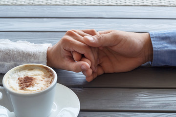 man and women hold each other hands coffee shop hands of people romance relationship