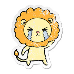 distressed sticker of a cartoon crying lion