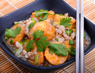 Stir Fried Tofu in a bowl with sesame and greens. Homemade healthy vegan asian meal - fried tofu